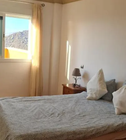 Daire With A Serene Ocean And Mountain View